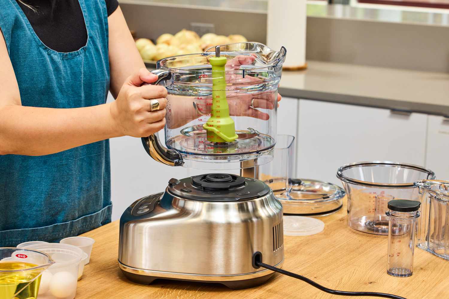 A person assembles the Breville BFP838BSS1BNA1 16-Cup Paradice Food Processor