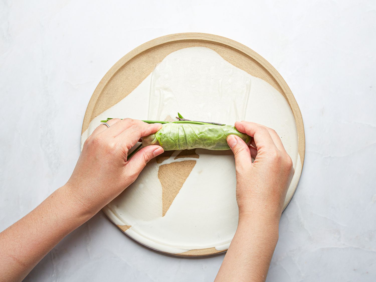 Overhead view of rolling rice paper