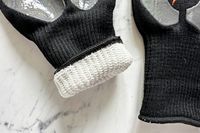 The cuff of the Blackstone Griddle Gloves is rolled up