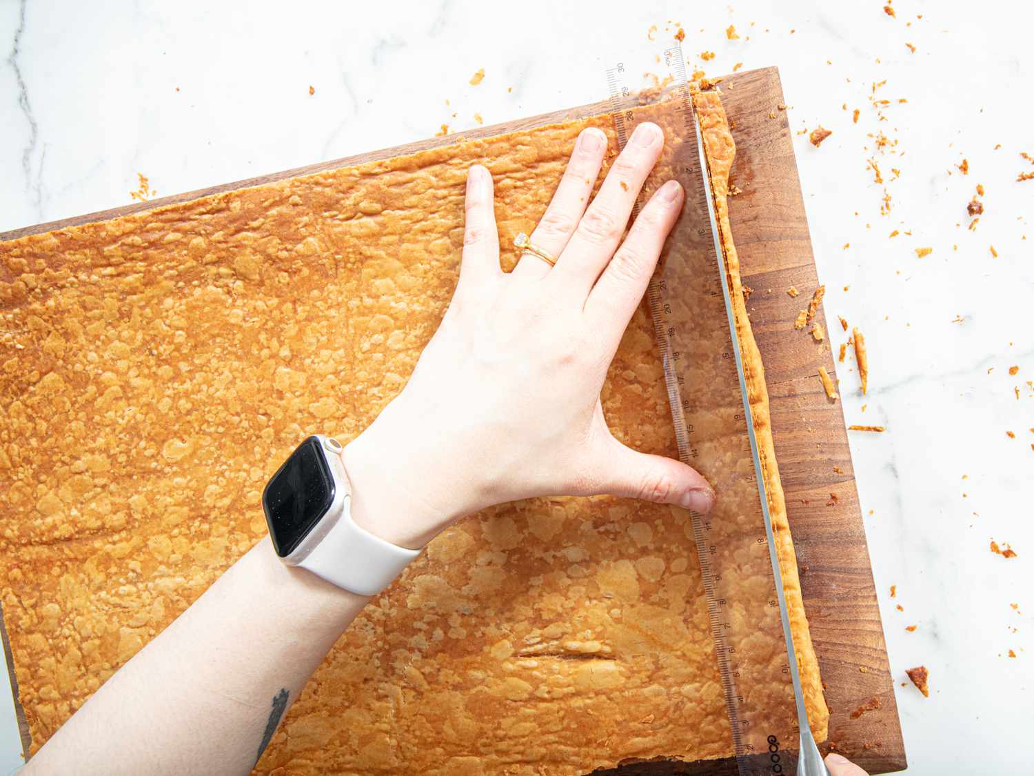 Overhead of trimming puff pastry