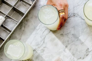 Overhead view of domo arigato cocktails next to a vintage ice cube tray.