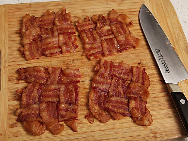 The cooked bacon weave is cut into four squares.
