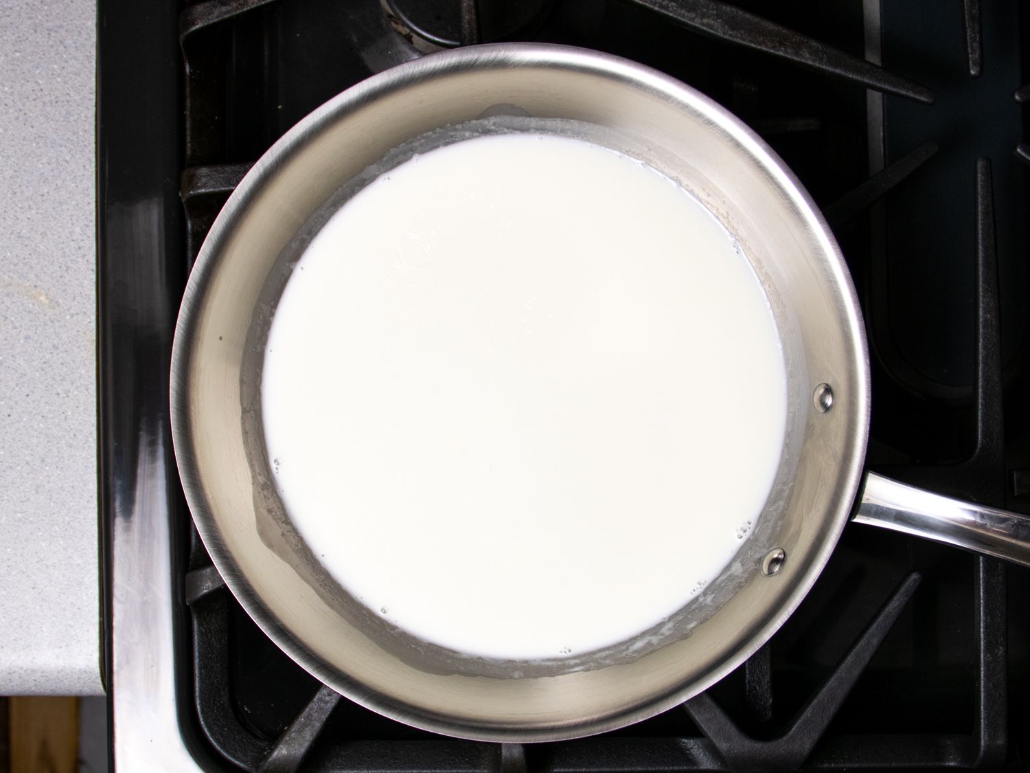 milk and cream cooking in a skillet