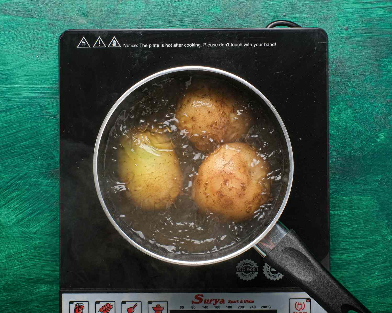Overhead view of potatoes cooking