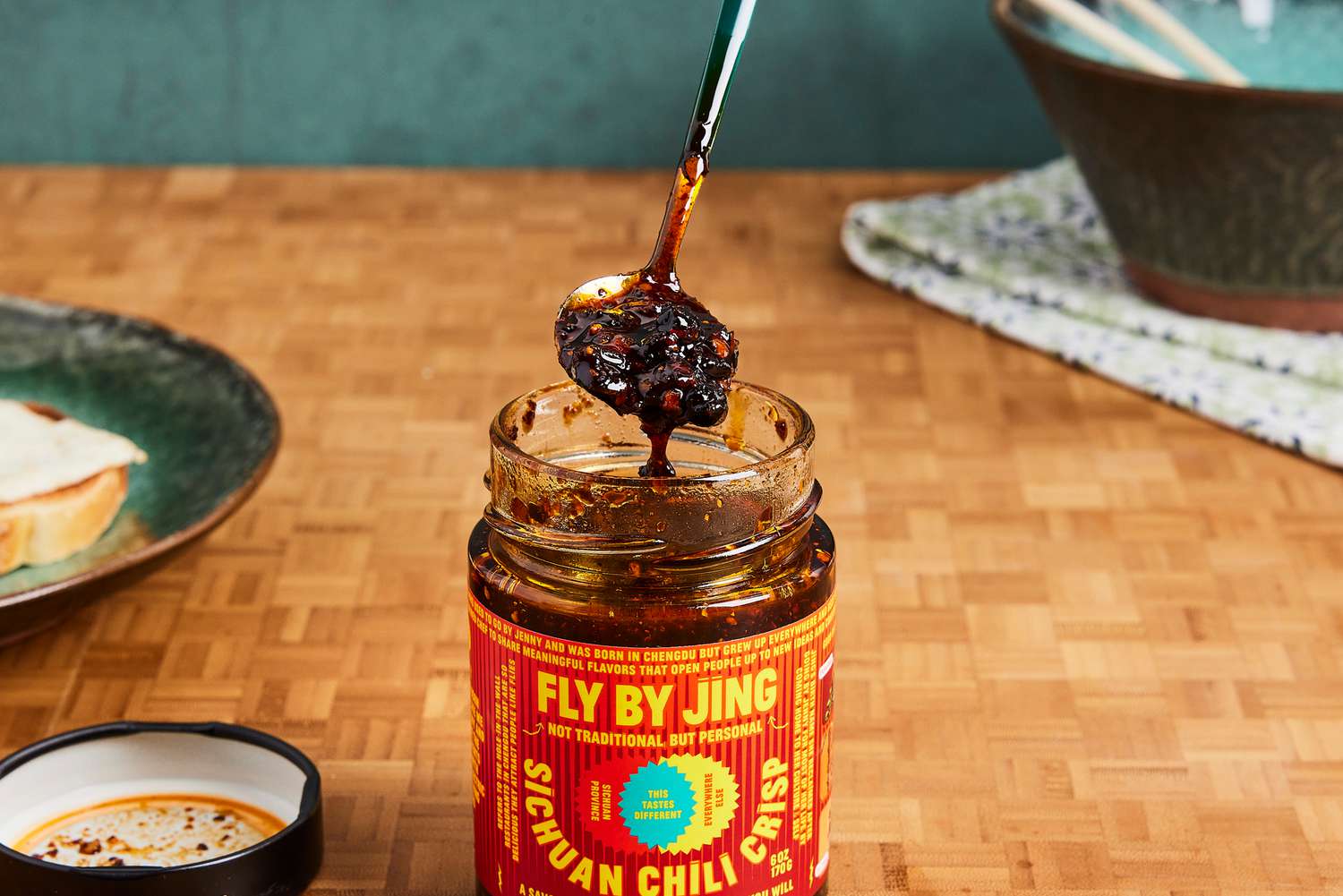 Fly By Jing Sichuan Chili Crisp being scooped