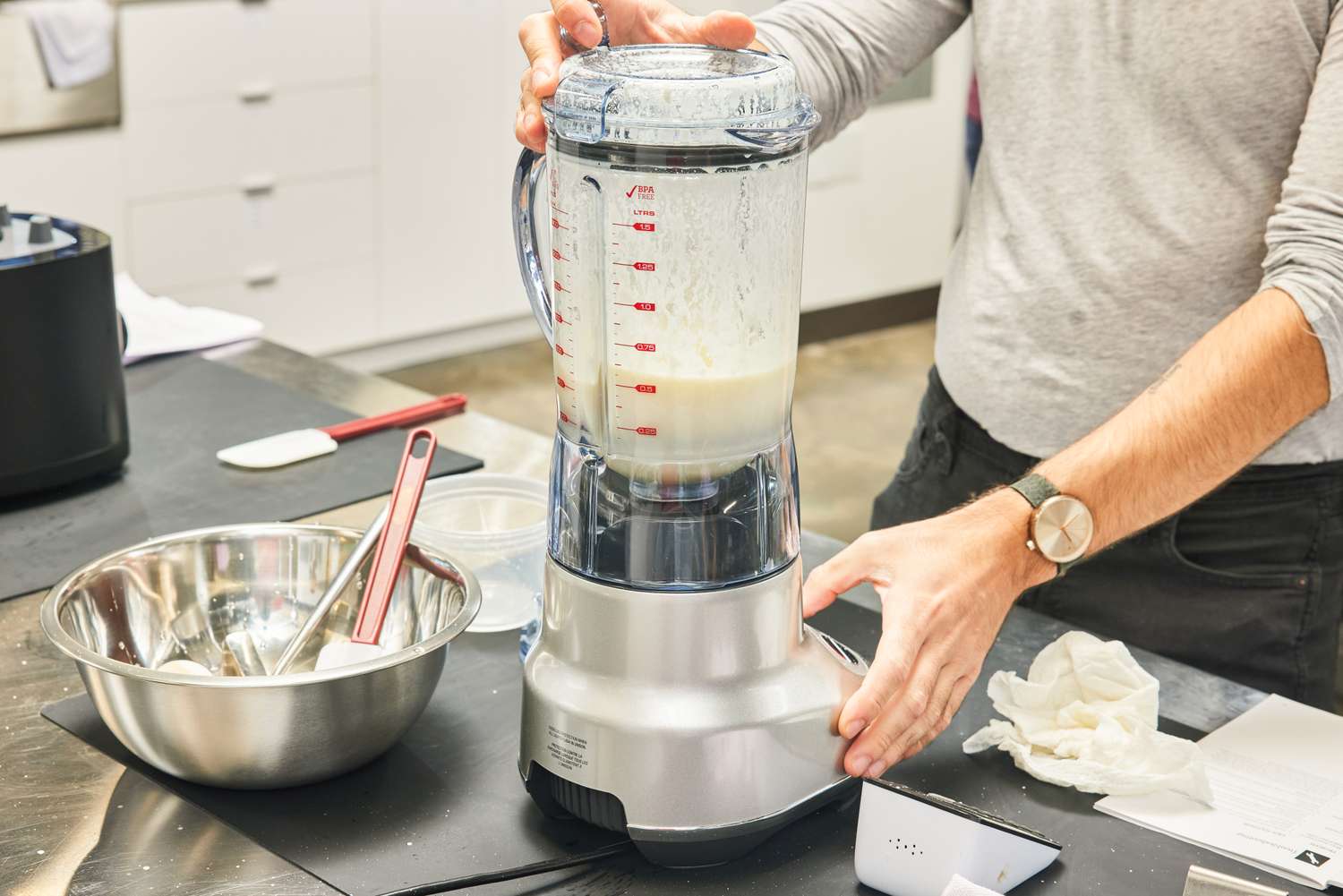 A person uses the Breville Fresh & Furious Blender