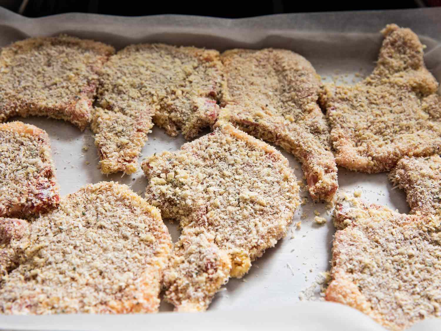 A tray of breaded pork chops.