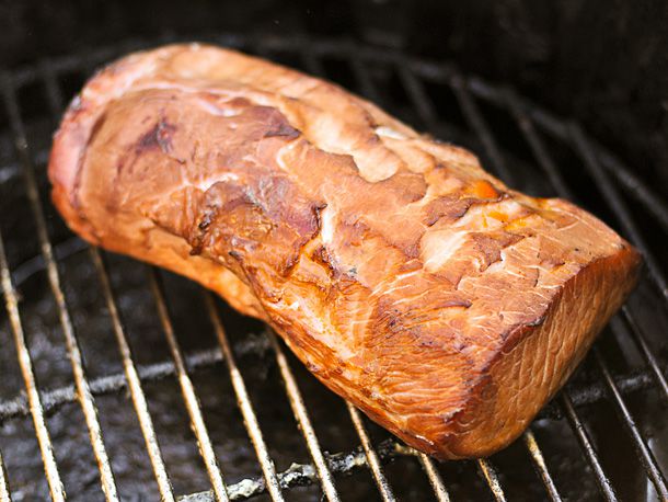 A smoked pork loin on the grill. 