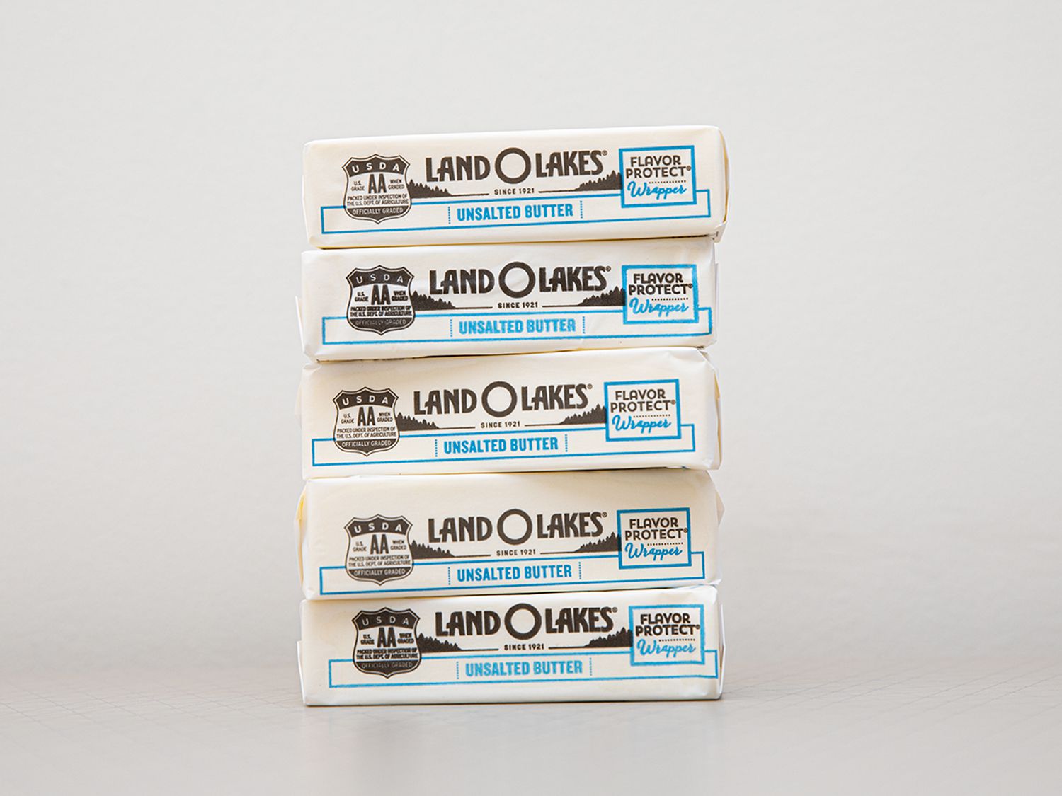 A stack of 5 sticks of Land O Lakes butter