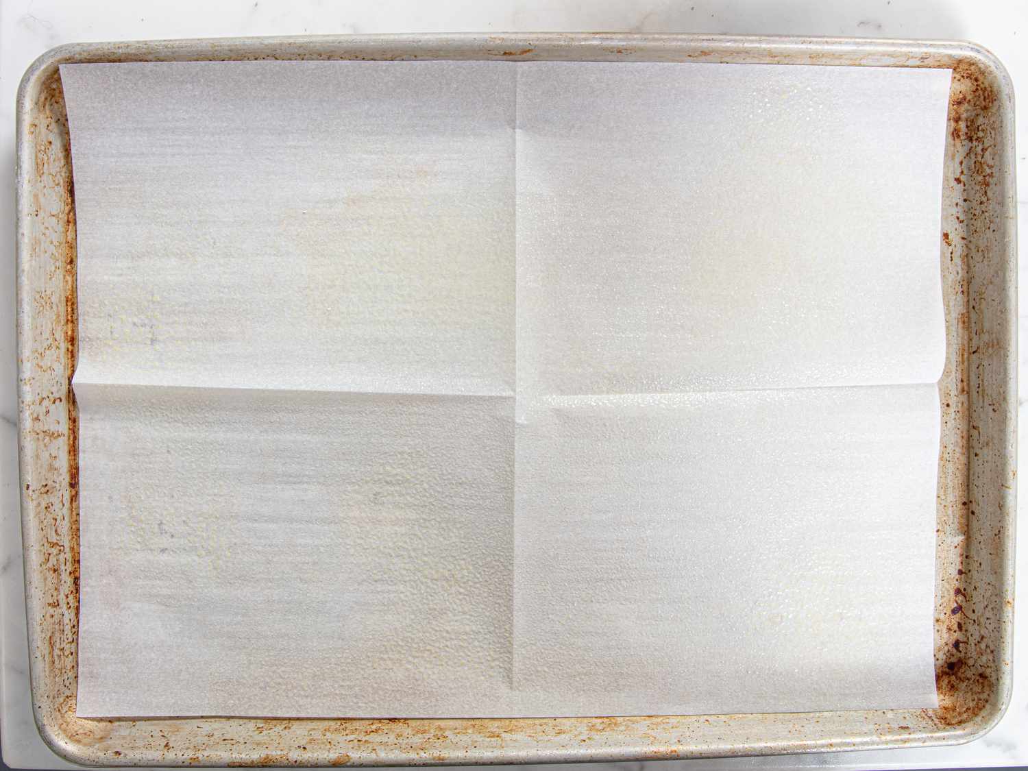 Overhead view of parchment paper lined tray