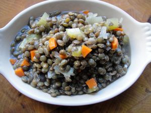 A small dish of cooked basic French green lentils. 