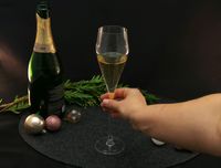 a person holding a champagne glass
