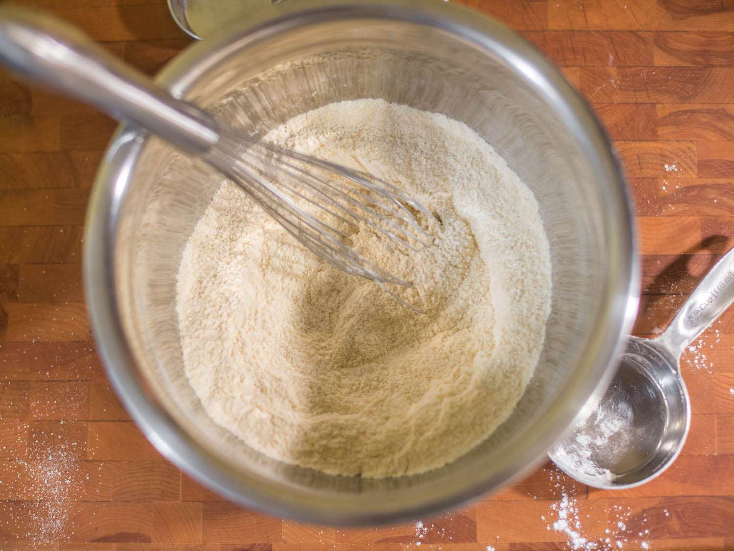Whisking together dry ingredients for corn bread.