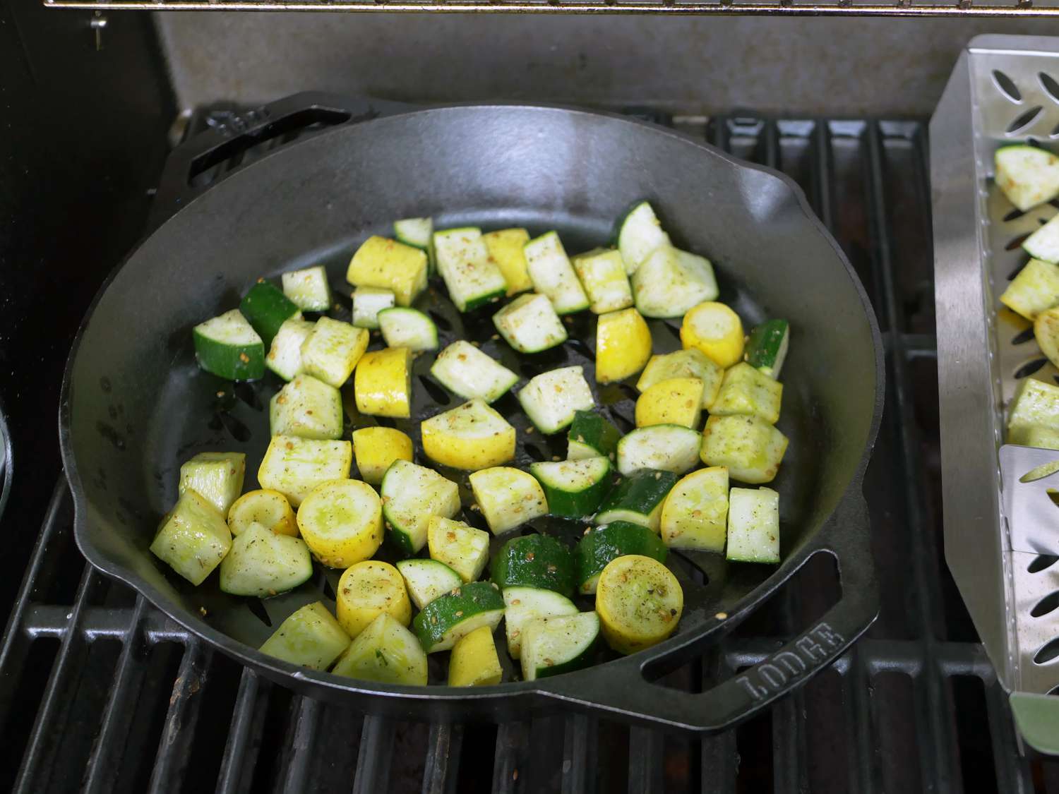 chopped zucchini and yellow squash in a grill pan 