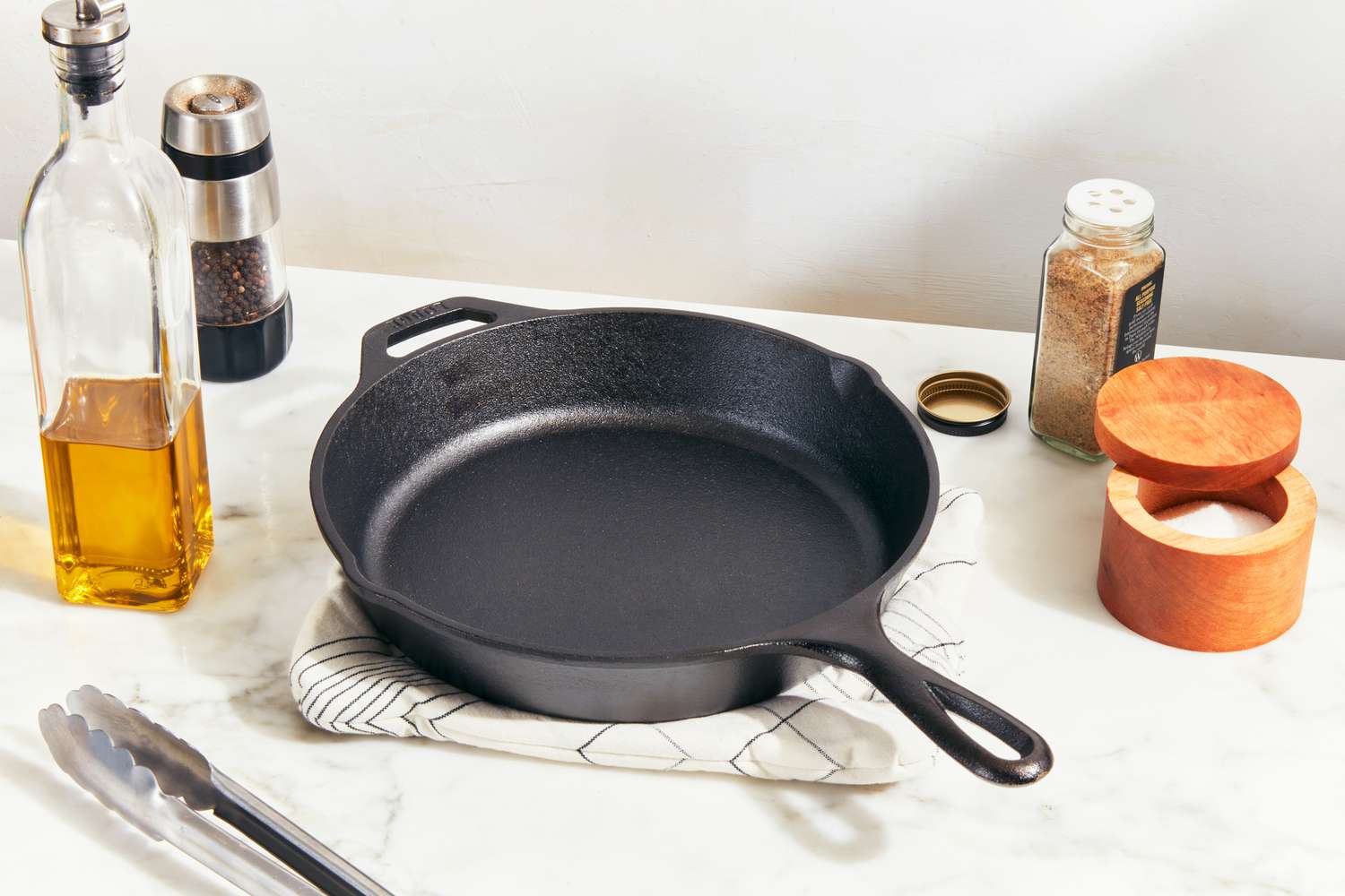 A cast iron skillet on a cluttered counter