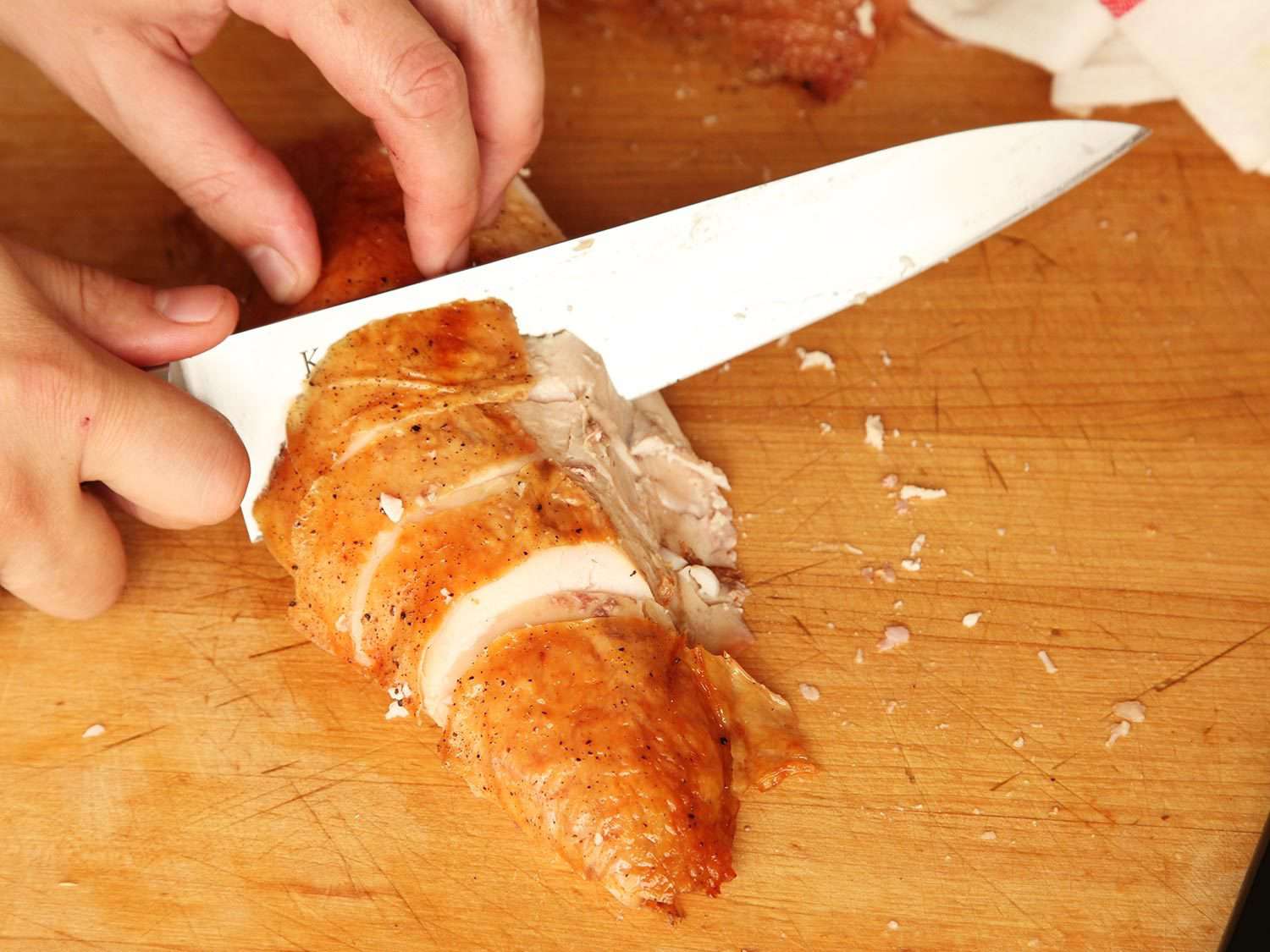 Overhead photo showing carving turkey breast.
