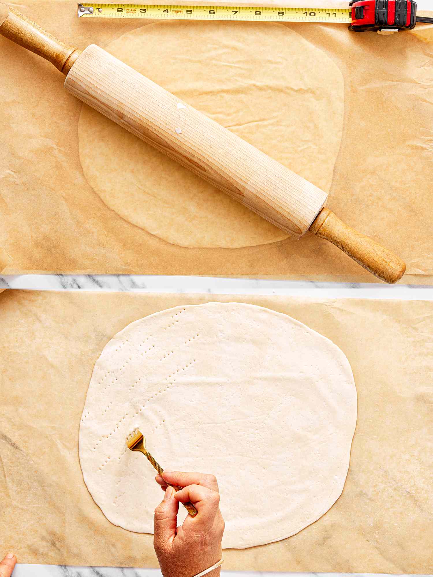 A rolling pin a ruler and a person brushing pastry dough on parchment paper