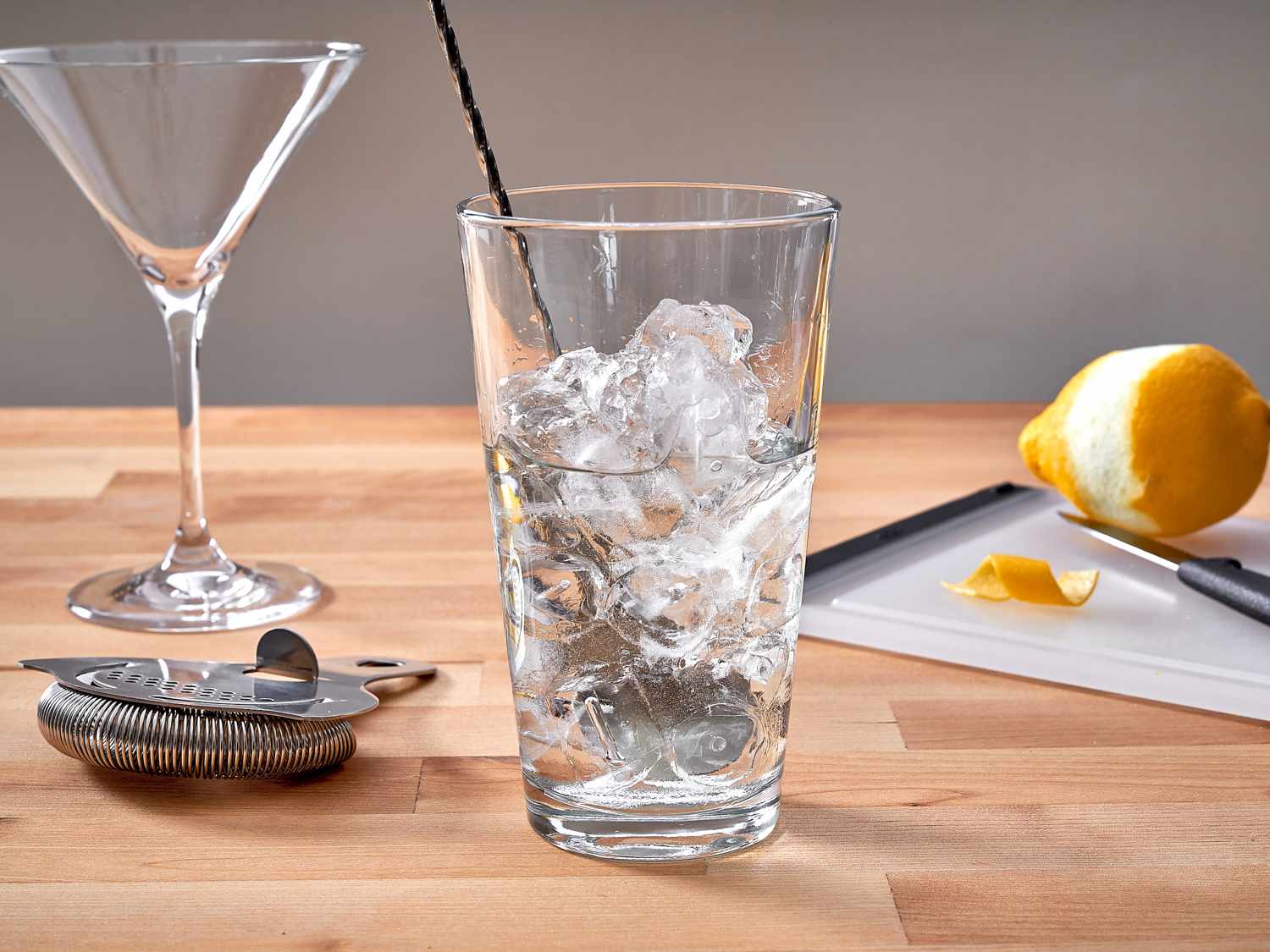 mixing a vesper cocktail in a glass