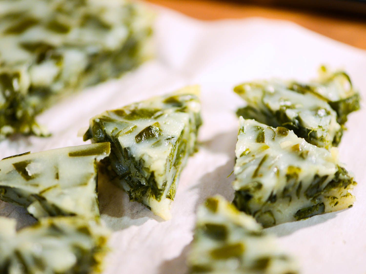 Chive cakes cut into triangles. 