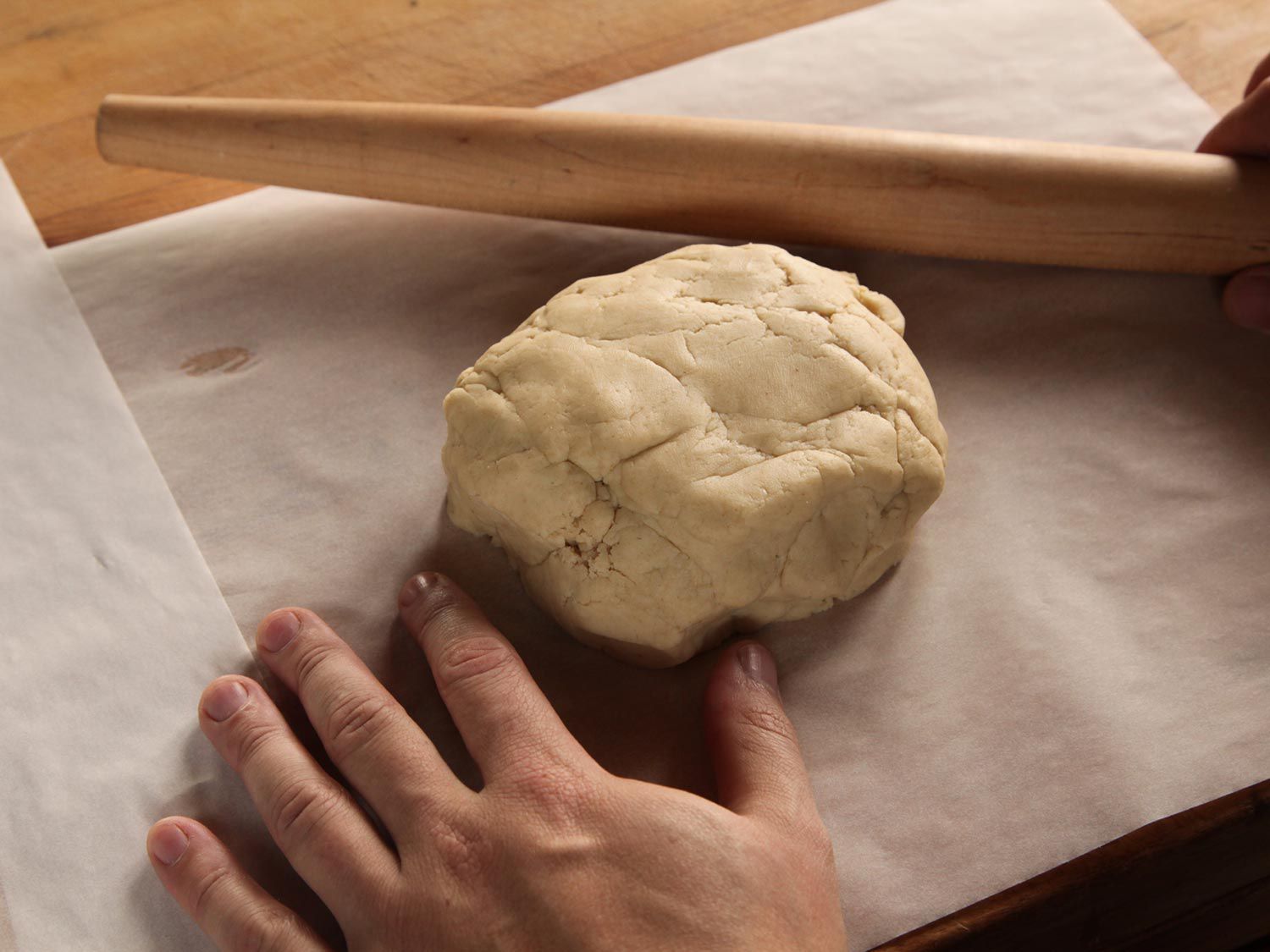 A mound of shortbread dough on parchment paper