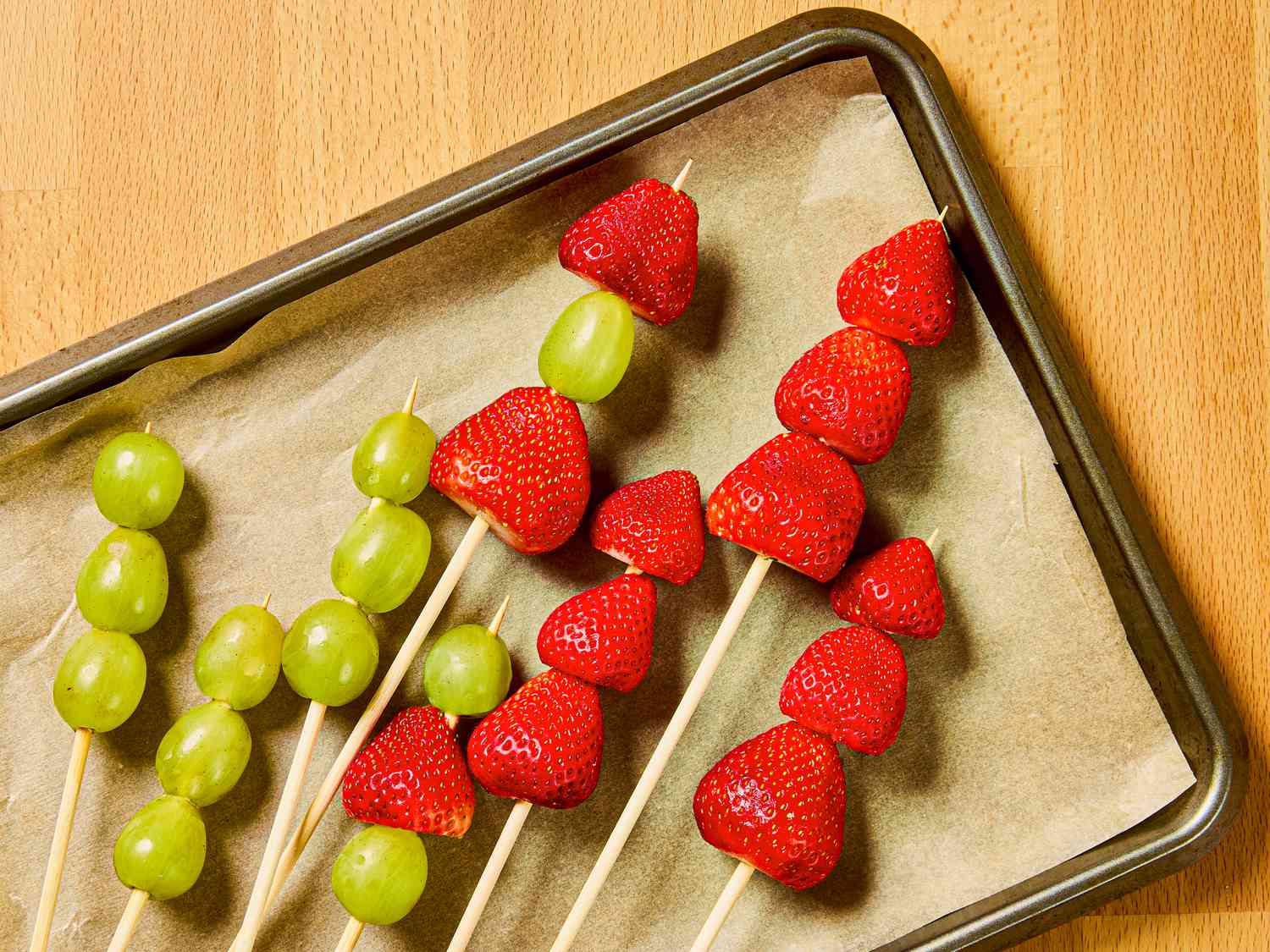 Fruit laying on sheet pan lined with parchment paper 