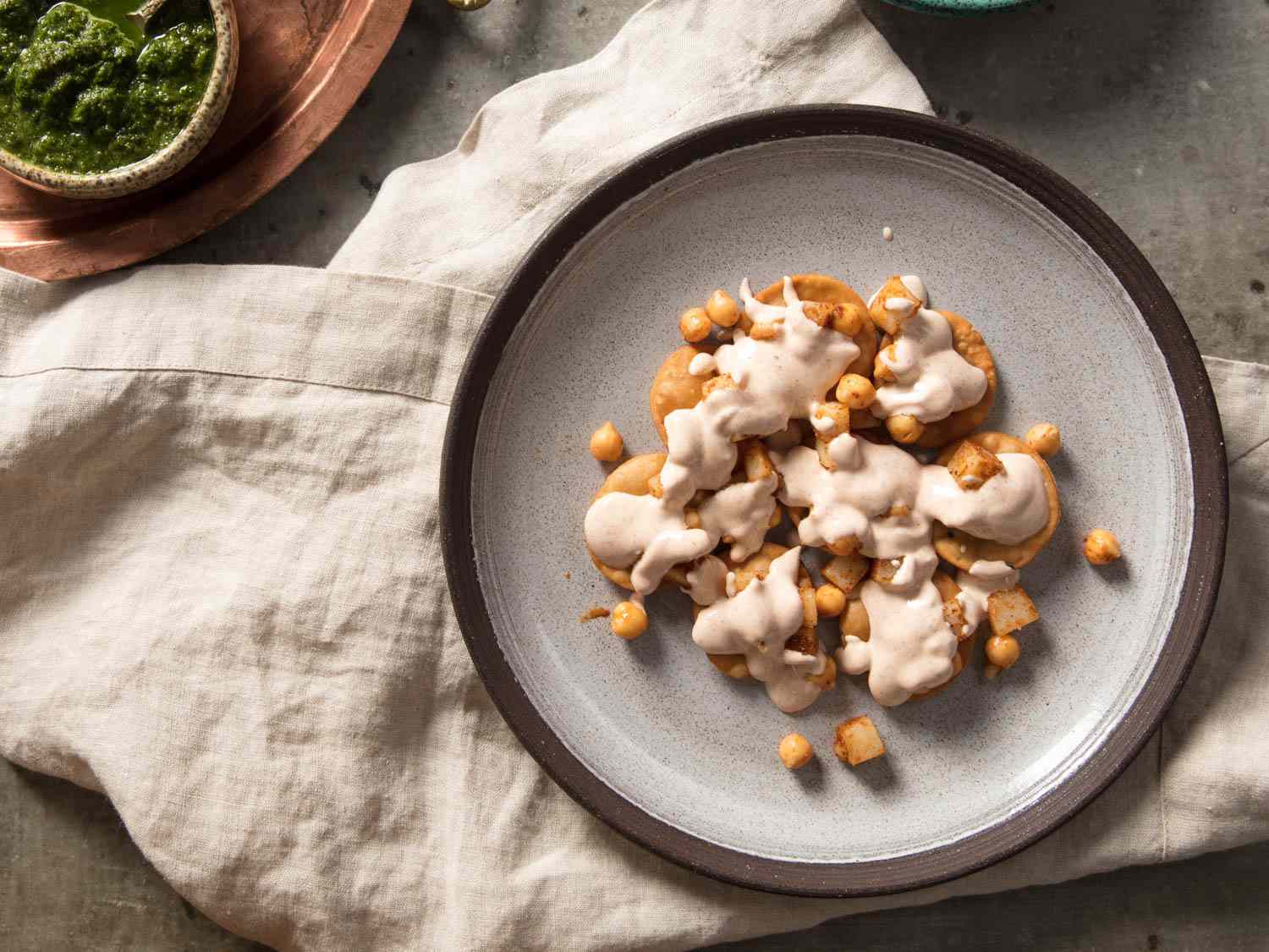 Papris, potatoes, and chickpeas now topped with spiced yogurt.