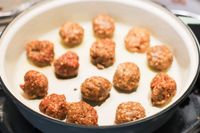 Misen Enameled Cast Iron Braiser with meatballs