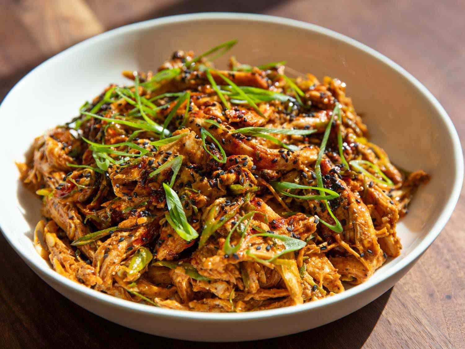 Closeup side view of a bowl of Sichuan-style turkey salad.