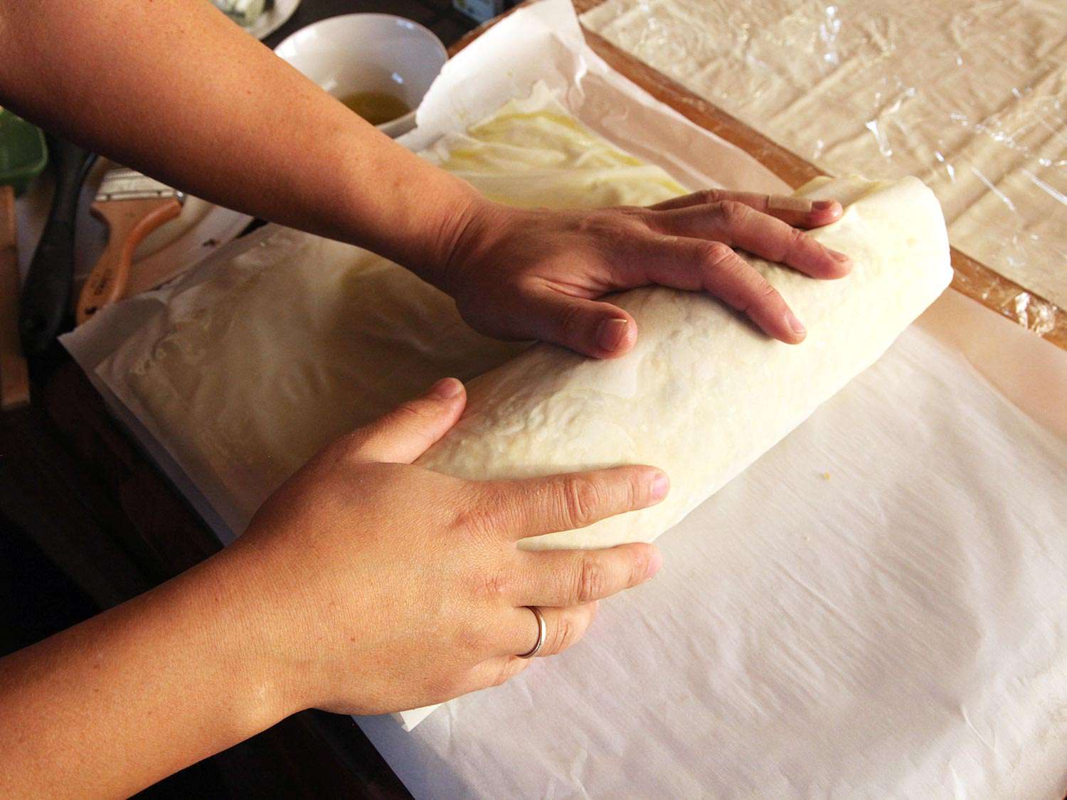 Rolling Wellington in additional phyllo sheets.