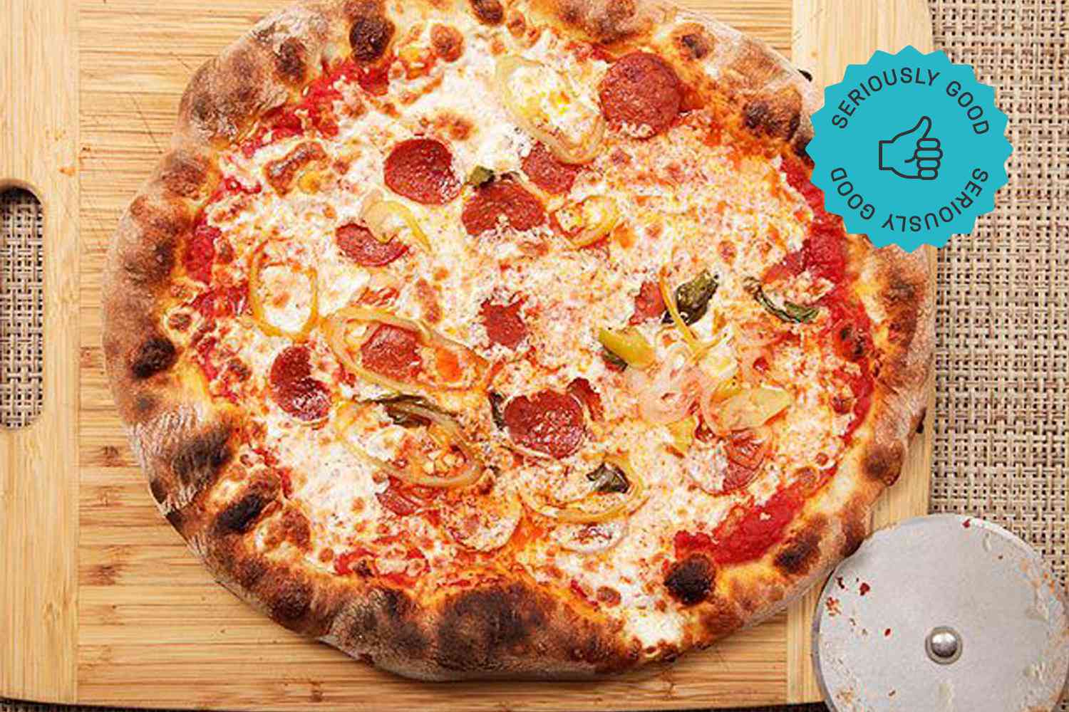 A pizza on a wooden cutting board 