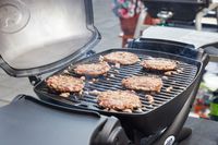 Burgers cooking on the Weber q1200 gas grill.