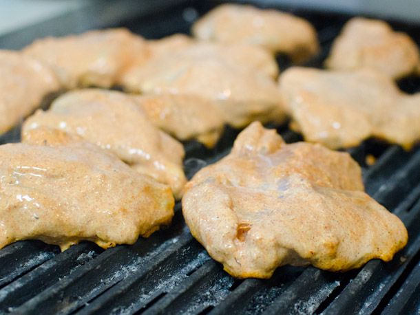 Marinated chicken thighs on the grill for chicken tikka makhani