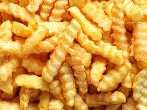 A closeup of crinklecut French fries
