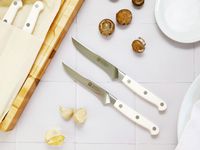 zwilling steak knives on a white surface