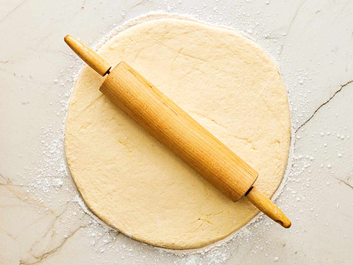 Overhead view of rolling out dough