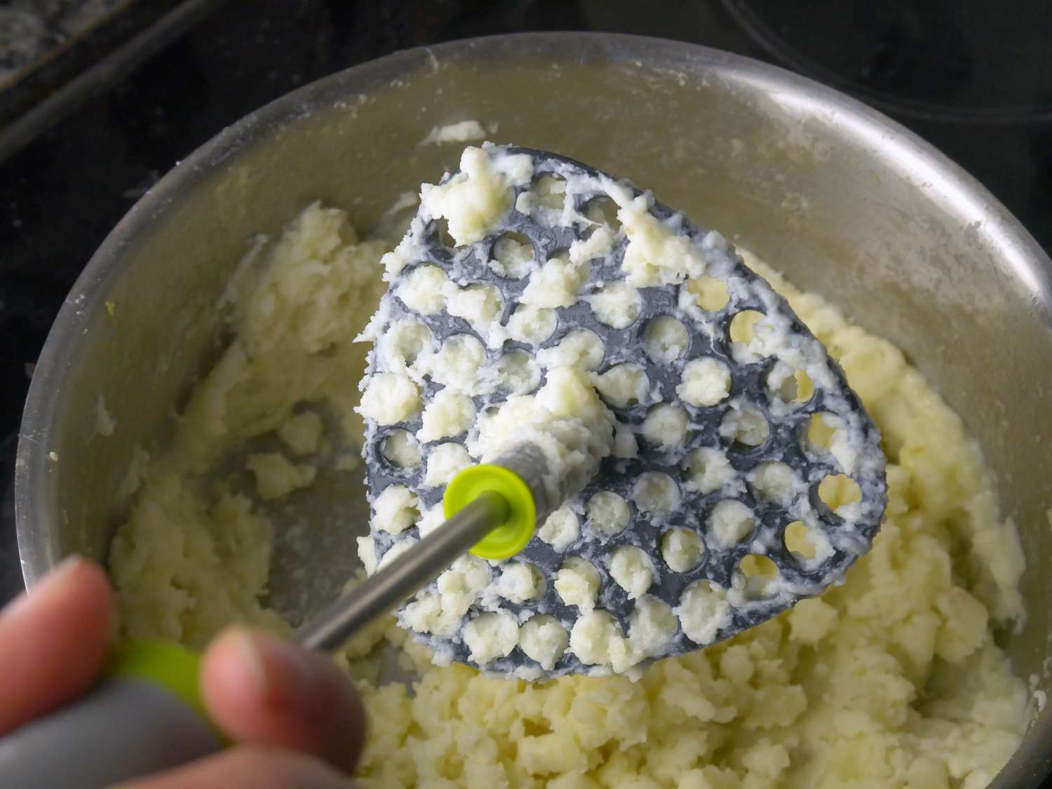 a closeup of the mashing head of the joseph joseph 