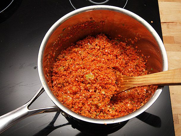Lentils are added to the pot and cooked with the aromatics.
