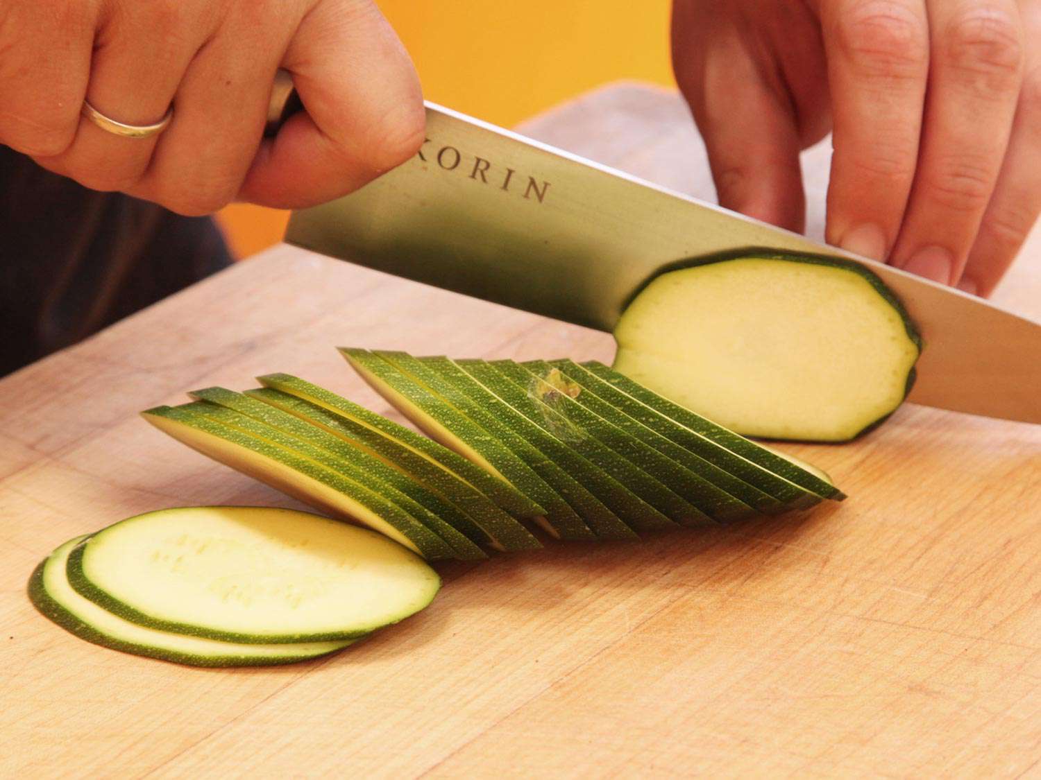 Author thinly slices zucchini on the bias.