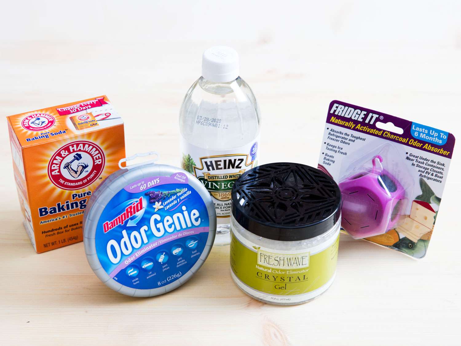 Five cleaning products on a counter.