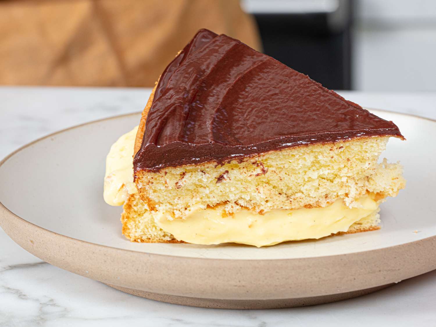 Side view of slice of Boston Cream Pie