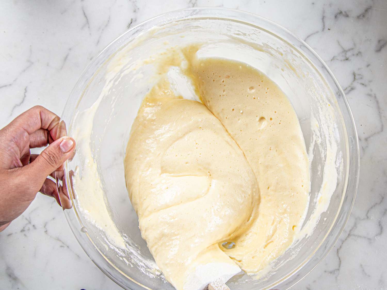 Overhead of folding the flour in a D shape