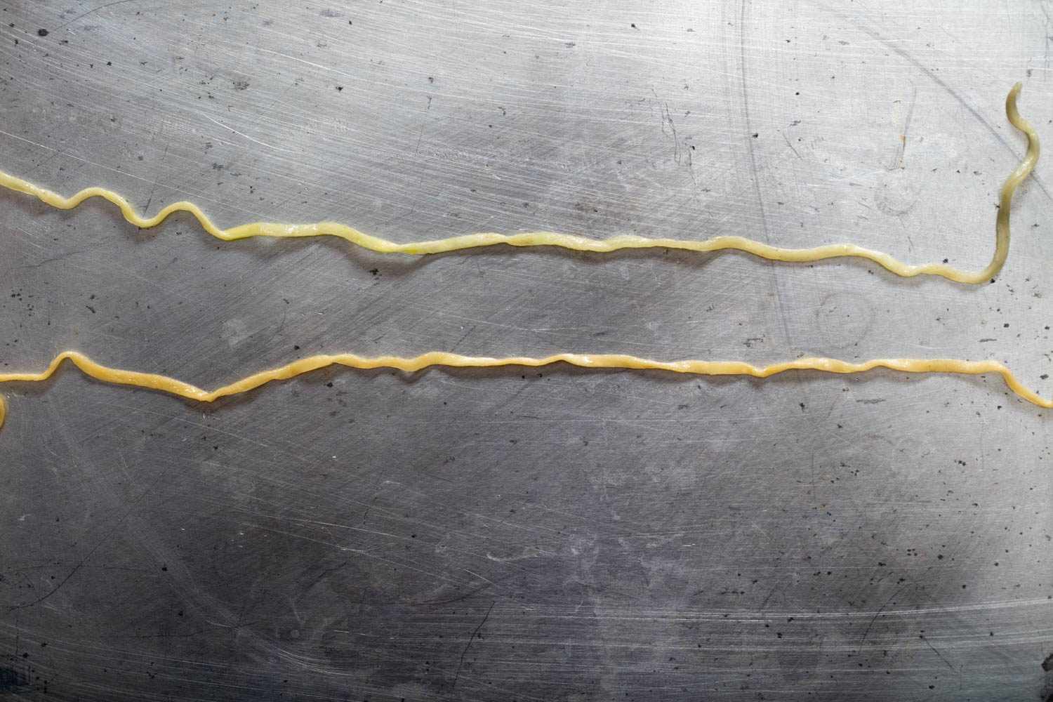 American Chicken Cup Noodles noodle on top compared with original Japanese Cup Noodles noodle on bottom.