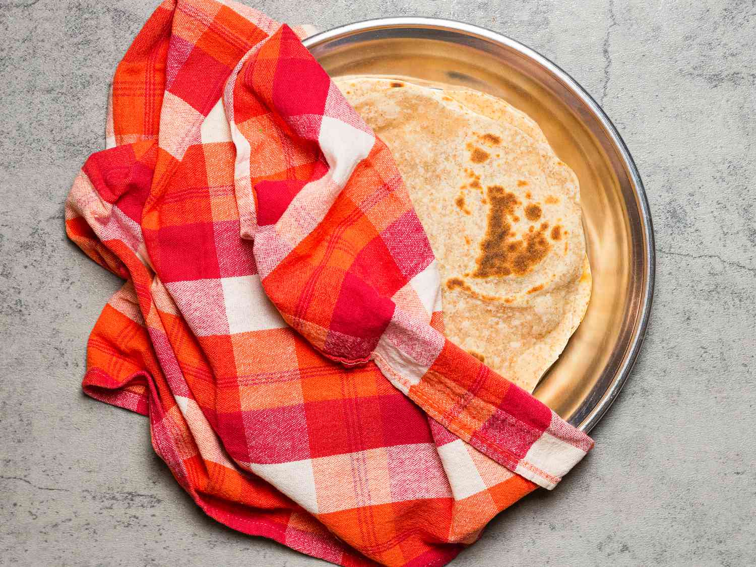 Overhead view of covering chapati 