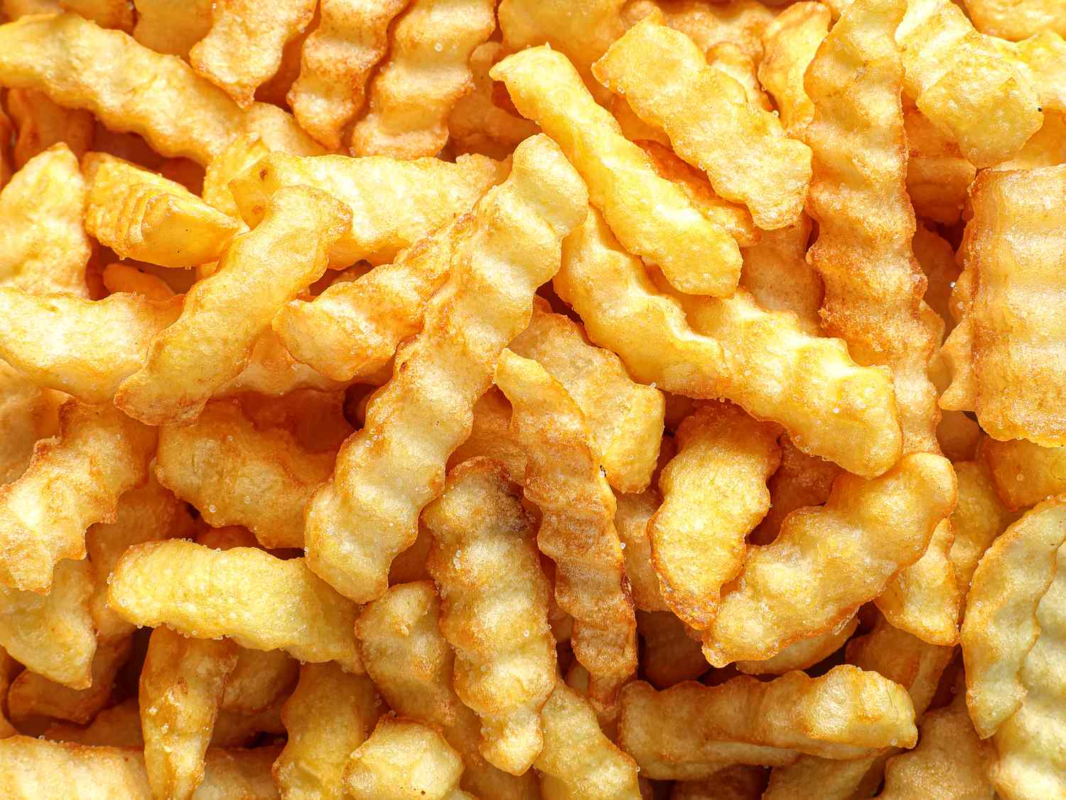 A closeup of crinklecut French fries