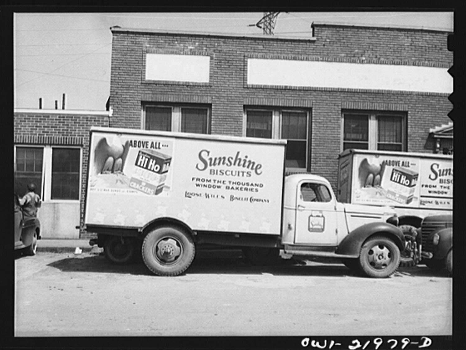 A vintage black and white photo of a Sunshine biscuits delivery truck.