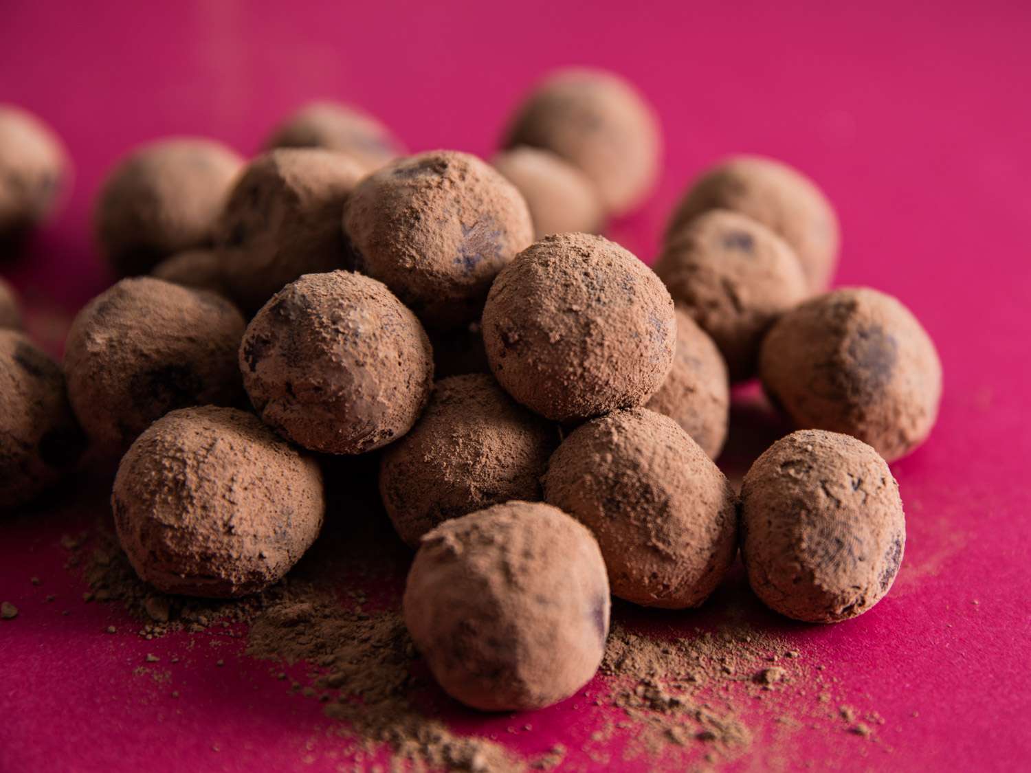 A pile of cocoa-dusted chocolate ganache truffles. 