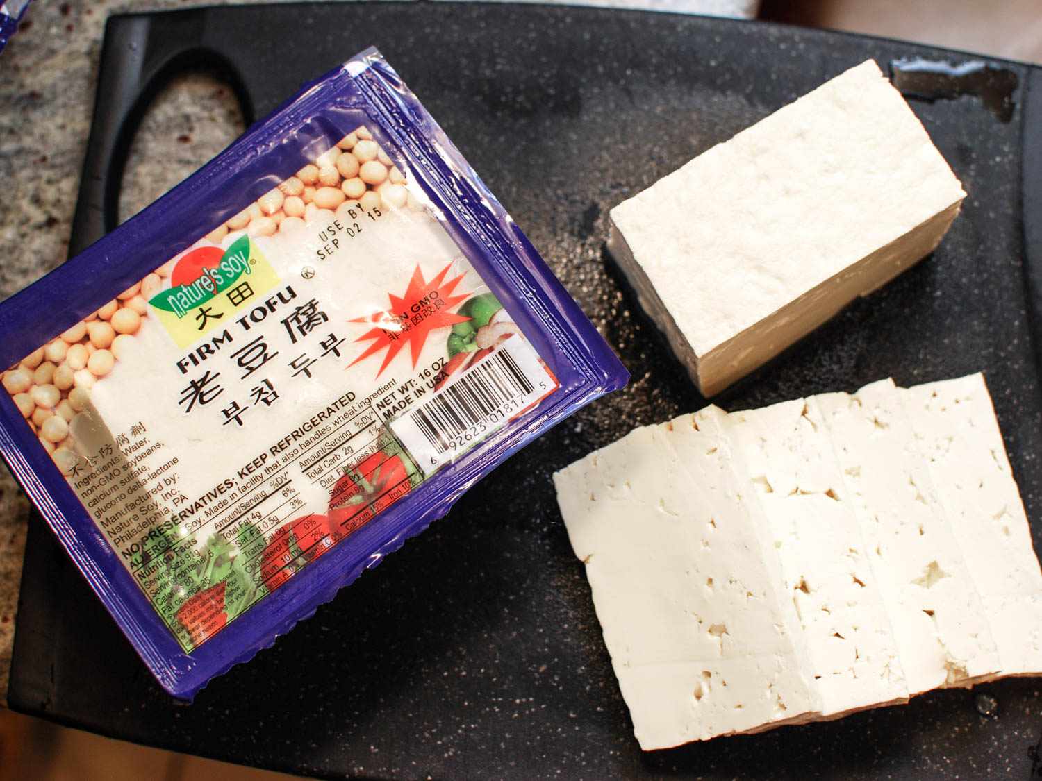 Overhead shot of firm tofu in and out of packaging.