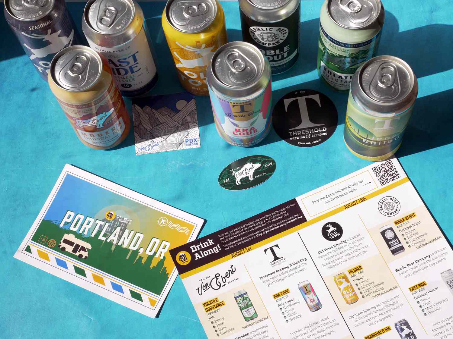 Various cans of beer on a blue surface