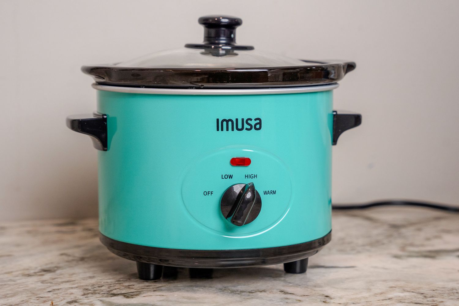 IMUSA 1.5 Quart Slow Cooker displayed on kitchen counter