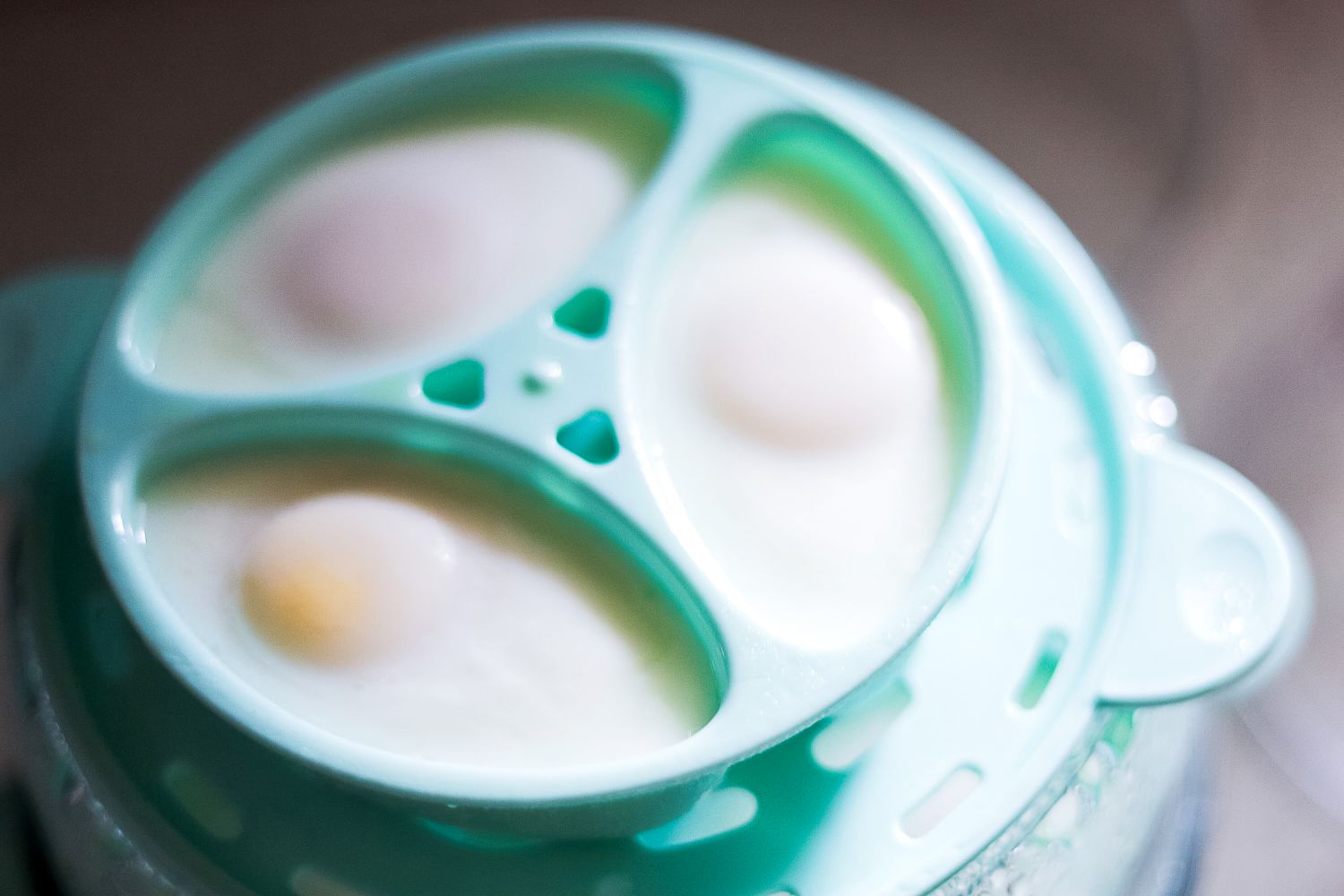 A closeup of poached eggs in the Dash egg cooker